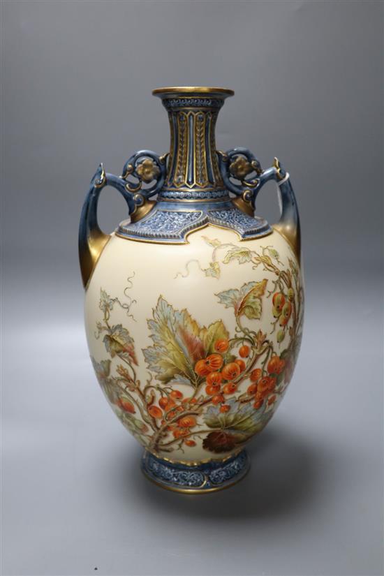 A Royal Worcester porcelain two-handled vase, the bulbous body painted with fruit and foliage, height 31cm, shape 1200